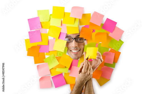 Photo: Man's face through paper and reminders Man's face through paper and reminders