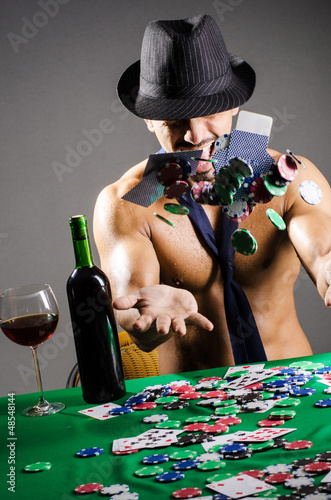 Photo: Naked broke businessman in casino Naked broke businessman in casino