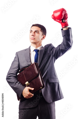 Photo: Businessman with boxing gloves on white Businessman with boxing gloves on white