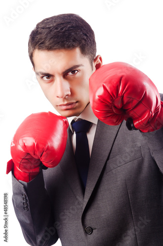 Photo: Businessman with boxing gloves on white Businessman with boxing gloves on white