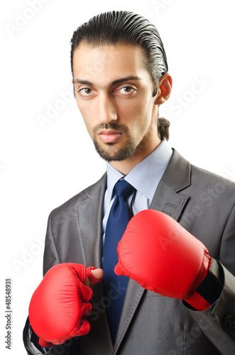 Photo: Businessman with boxing gloves on white Businessman with boxing gloves on white