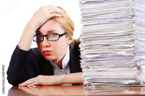 Photo: Woman businesswoman with lots of papers Woman businesswoman with lots of papers