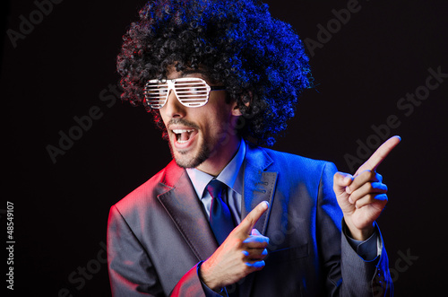 Photo: Singer with afro cut in dark studio Singer with afro cut in dark studio