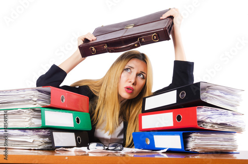 Photo: Busy woman with stacks of paper Busy woman with stacks of paper
