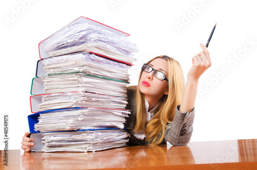 Photo: Busy woman with stacks of paper Busy woman with stacks of paper