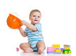 kid playing with building blocks toy