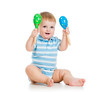 Baby  boy playing with musical toys. Isolated on white backgroun