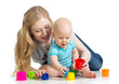 kid boy and mother playing together with cup toys
