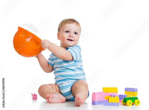 Photo: kid playing with building blocks toy kid playing with building blocks toy