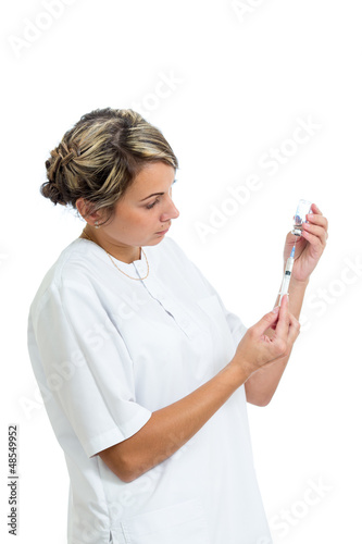 Photo: Doctor holding syringe with a medicine, isolated on white Doctor holding syringe with a medicine, isolated on white
