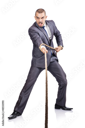Photo: Man pulling the rope on white Man pulling the rope on white