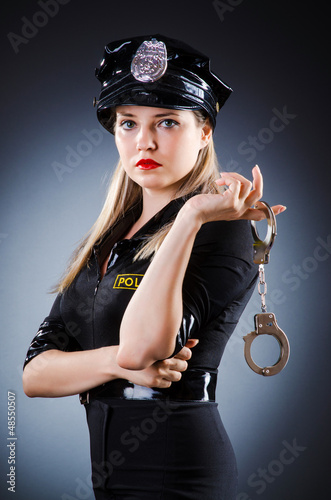 Photo: Attractive police office in dark room Attractive police office in dark room
