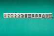 Smooth table surface with a mahjong on it