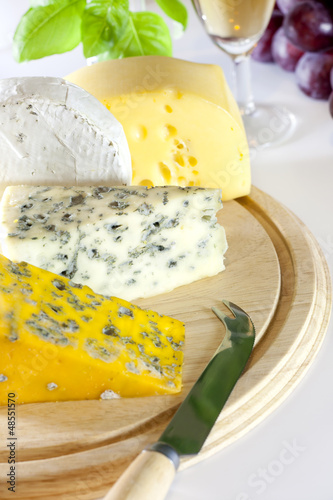Photo: Cheese various assortment on wooden boards Cheese various assortment on wooden boards