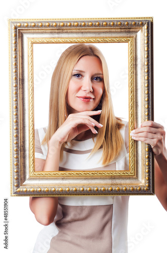 Photo: Woman with picture frame on white Woman with picture frame on white