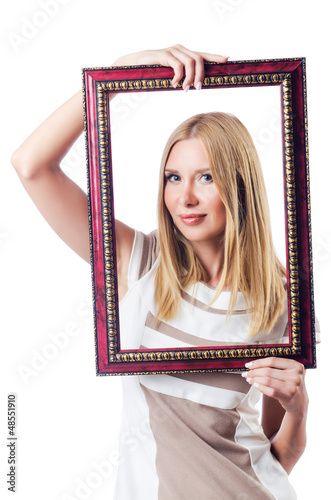 Photo: Woman with picture frame on white Woman with picture frame on white