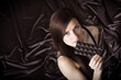 Portrait of woman nibbling the bar of chocolate, view from above