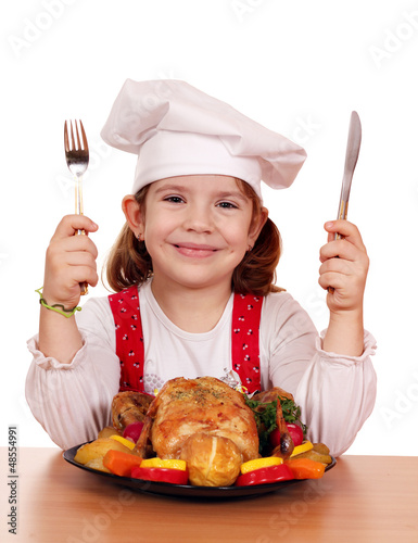 Photo: little girl cook with grilled chicken little girl cook with grilled chicken