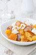salad with persimmon, mandarin oranges and goat cheese vertical