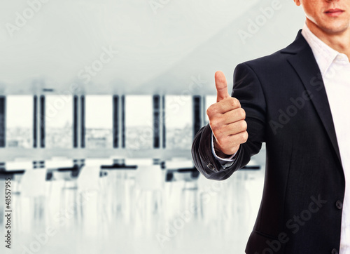 Photo: A business man with thumb up A business man with thumb up