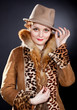 Attractive  redhaired curly    woman wearing  felt hat