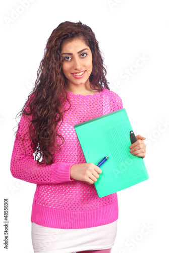 Photo: Pretty student holding notes and pen Pretty student holding notes and pen