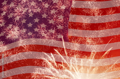 Photo: fireworks over United States flag fireworks over United States flag