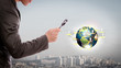 Foto: Business man look small world under a magnifying glass (Elemen Business man look small world under a magnifying glass (Elemen