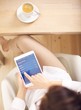 Photo: Top View of a Woman Holding a Digital Tablet Top View of a Woman Holding a Digital Tablet