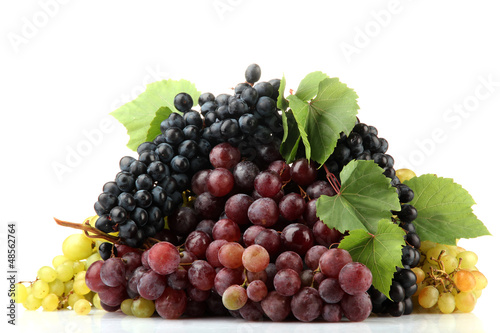 Photo: assortment of ripe sweet grapes isolated on white. assortment of ripe sweet grapes isolated on white.