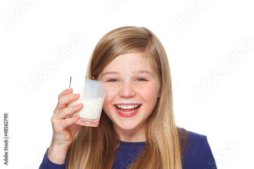 Photo: girl with a glass of milk and milk moustache smiling girl with a glass of milk and milk moustache smiling