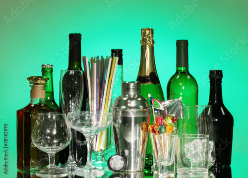Photo: Collection of various glasses and drinks on color background Collection of various glasses and drinks on color background