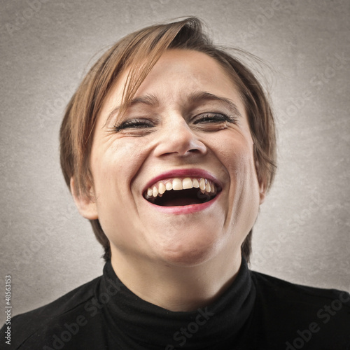 Photo: portrait of laughing woman portrait of laughing woman
