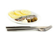 Dish of herring and lemon on plate isolated on white