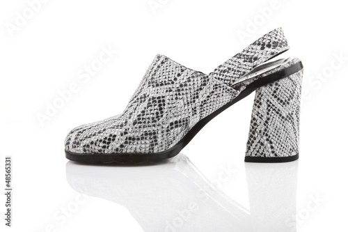 Photo: Snake leather women shoe, isolated on white Snake leather women shoe, isolated on white