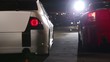 Two cars with colorful sport design moves forward at night