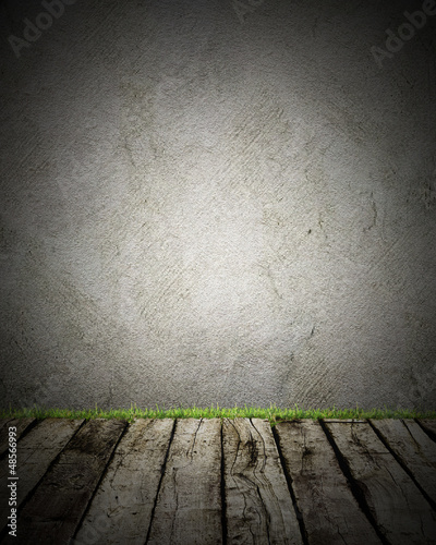 Photo: Wood and wall with grass # trash backgroud Wood and wall with grass # trash backgroud