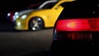 Automobile taillight blinks at background of several cars