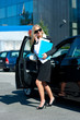 business woman exit her car