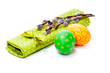 Photo: two painted easter eggs with pussy-willow on green serviette, is two painted easter eggs with pussy-willow on green serviette, is