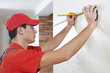Handyman with measuring tape