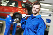 Photo: Repairman auto mechanic at work Repairman auto mechanic at work
