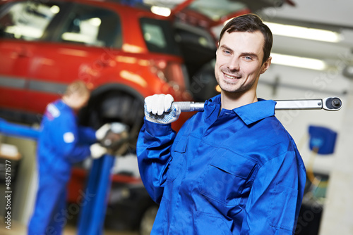 Photo: Repairman auto mechanic at work Repairman auto mechanic at work