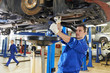auto mechanic at car suspension repair work
