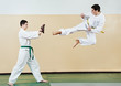 Two man at taekwondo exercises