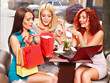 Women at laptop  in a cafe.