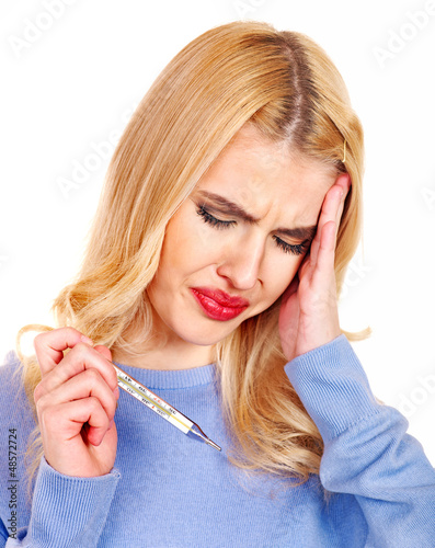 Photo: Woman having flue taking thermometer. Woman having flue taking thermometer.