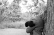 BW - Blonde woman at the woods, laughing
