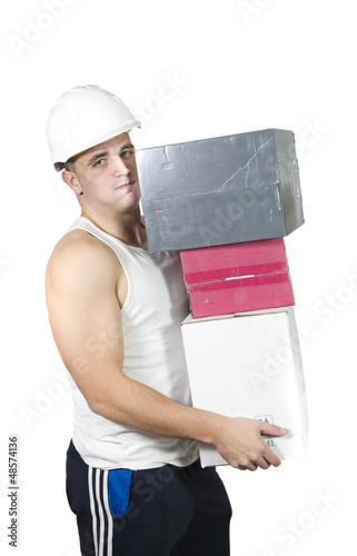 Photo: tired worker carrying boxes tired worker carrying boxes