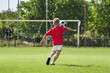 boy kicking footbal